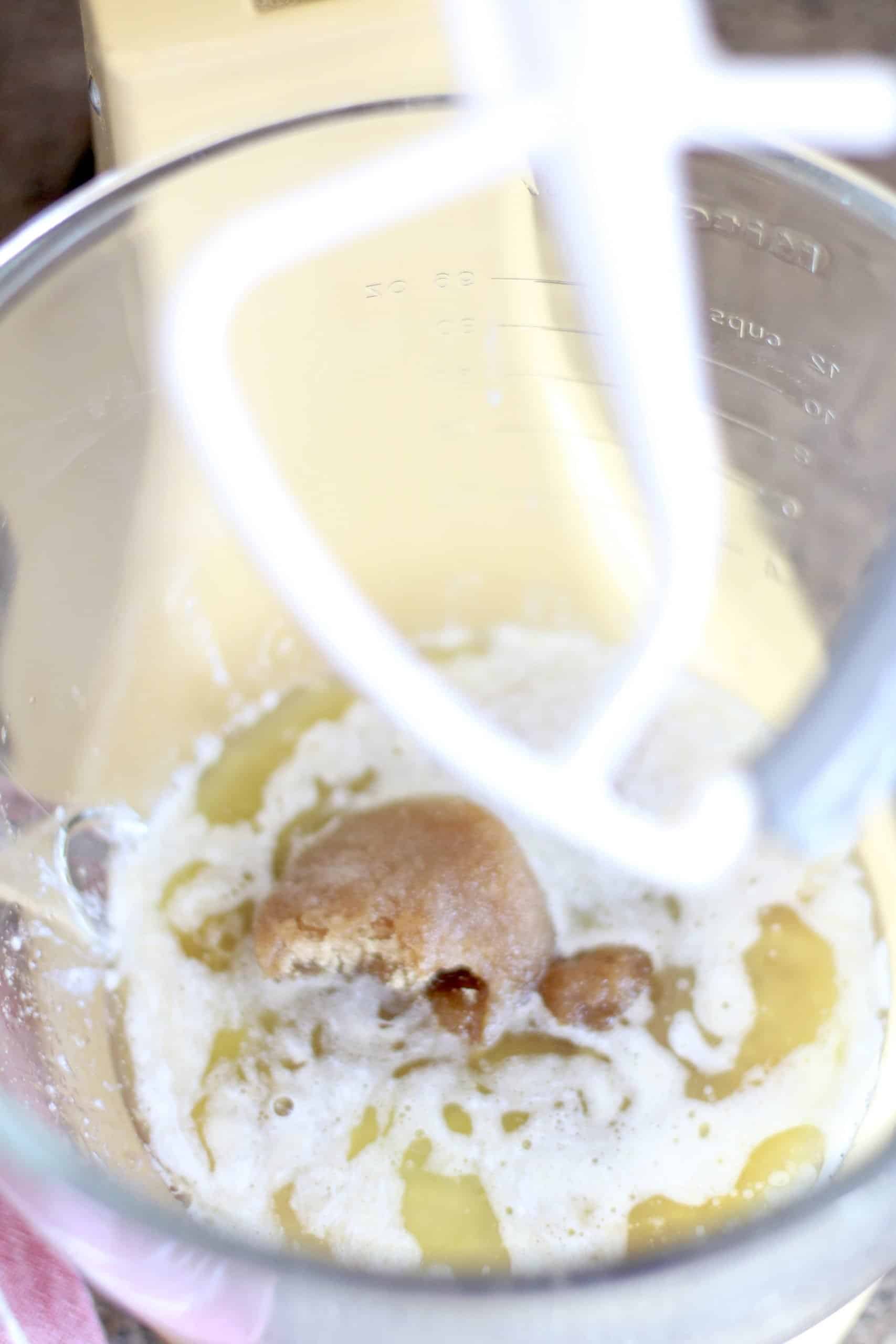 melted butter, brown sugar, maple syrup and vanilla extract in the bowl of a stand mixer.