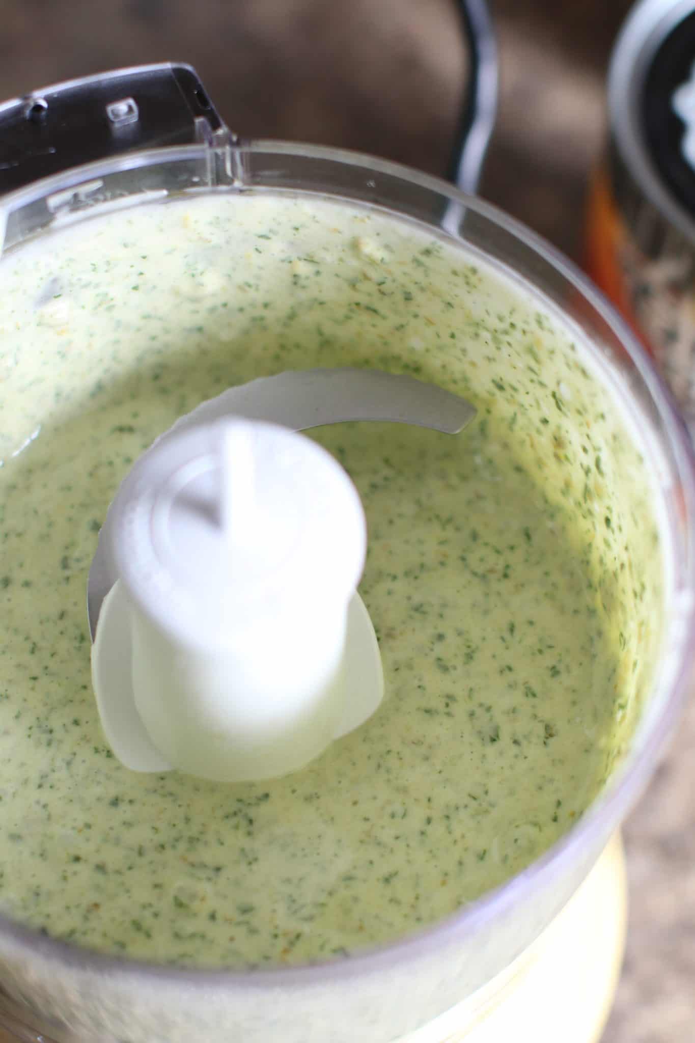 ranch dressing added to cilantro in food processor.