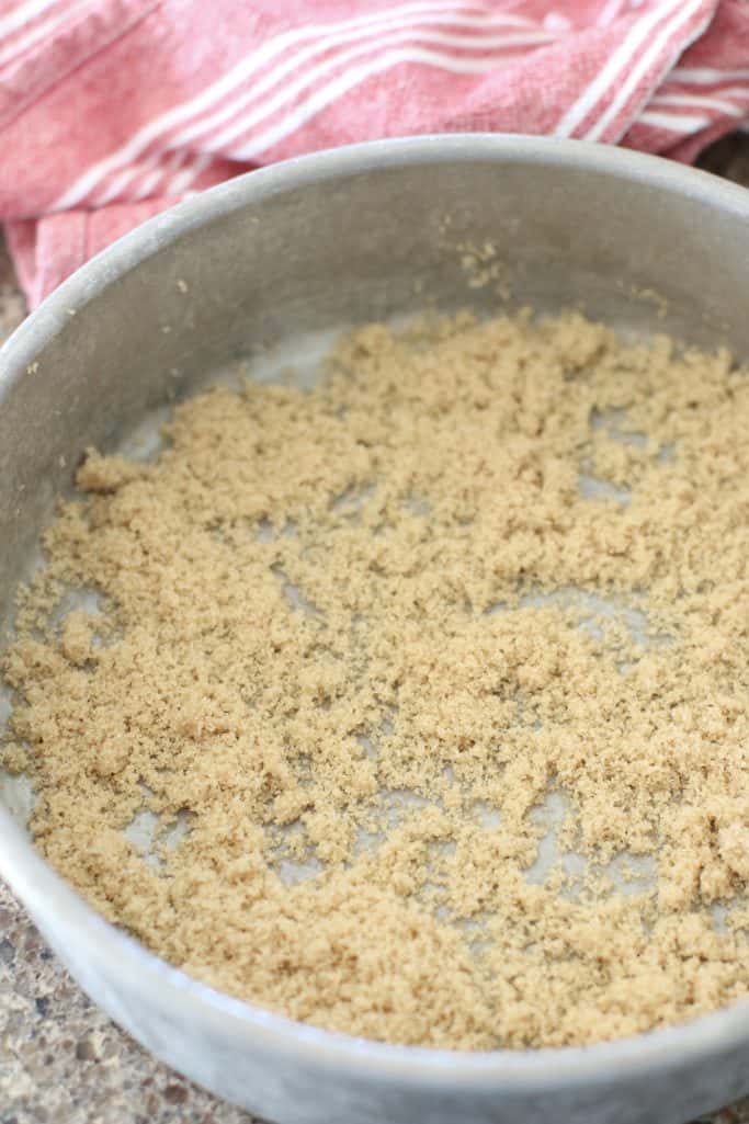brown sugar sprinkled into the bottom of a round baking dish