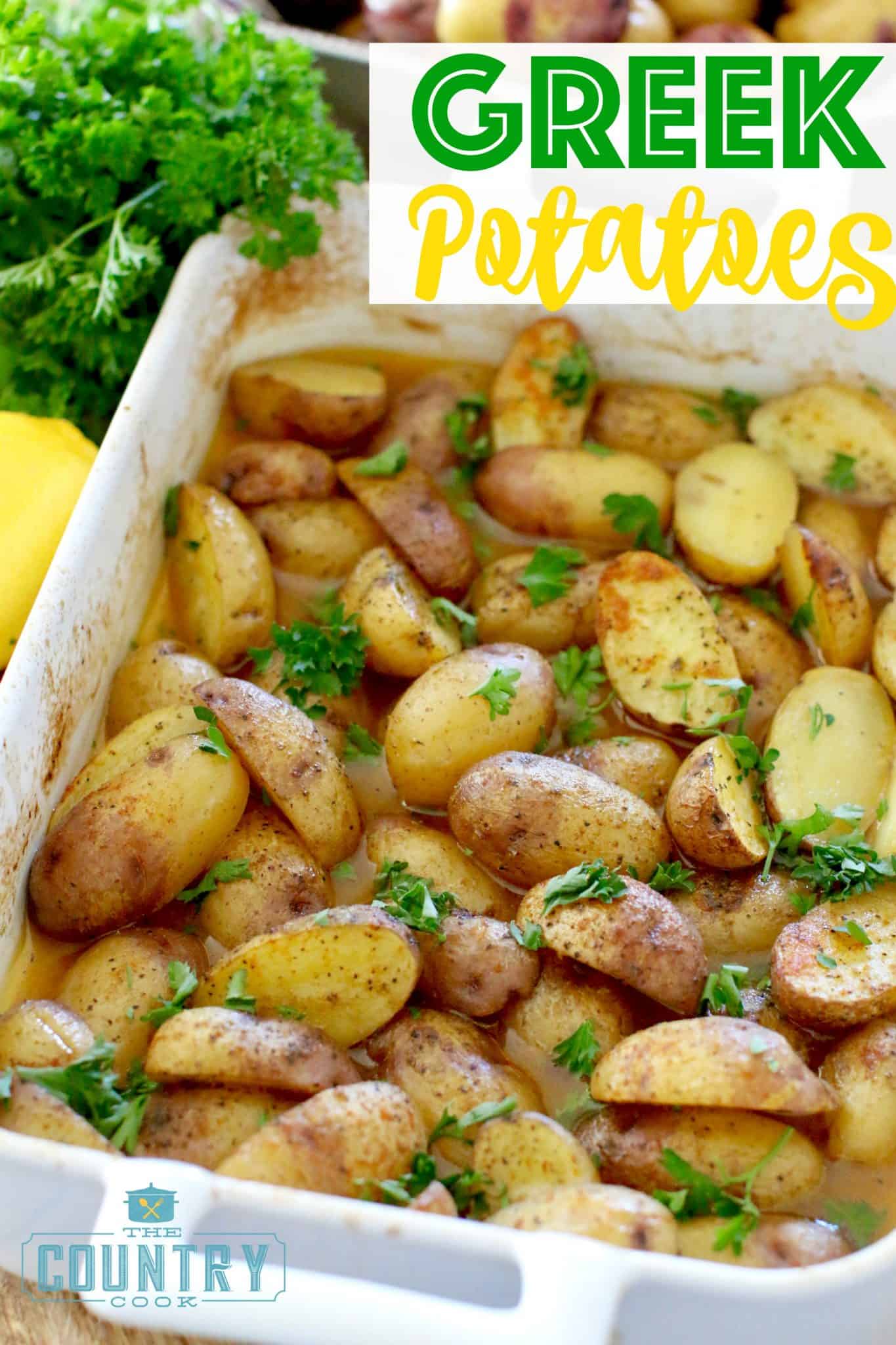 Greek Potatoes recipe from The Country Cook shown in a small white rectangular baking dish with fresh parsley on the side.