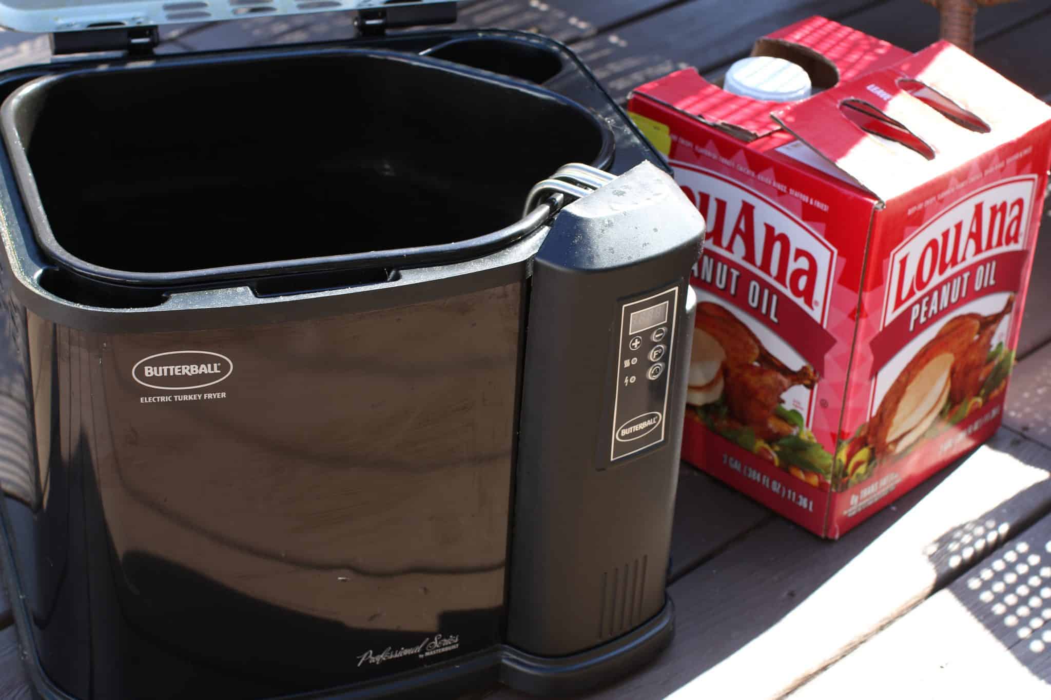 A Butterball Turkey Fryer with Lou Ana Peanut Oil shown sitting outside.
