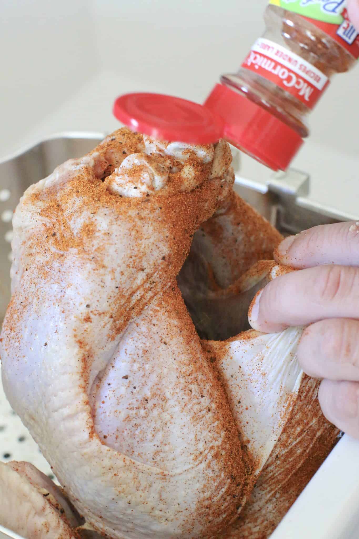 sprinkling rotisserie chicken seasoning inside the cavity of the turkey. 