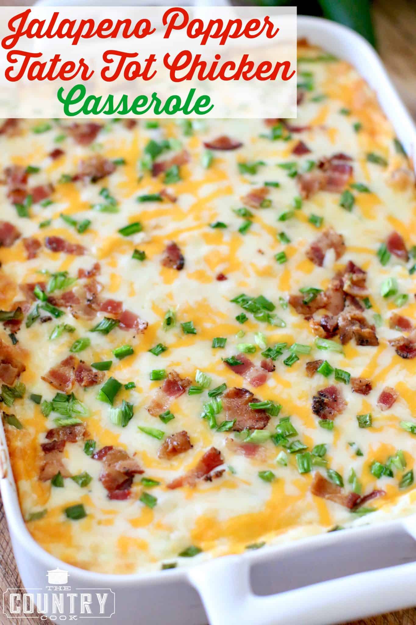 Jalapeno Popper Tater Tot Chicken Casserole shown fully baked with melted cheese in a white casserole dish.