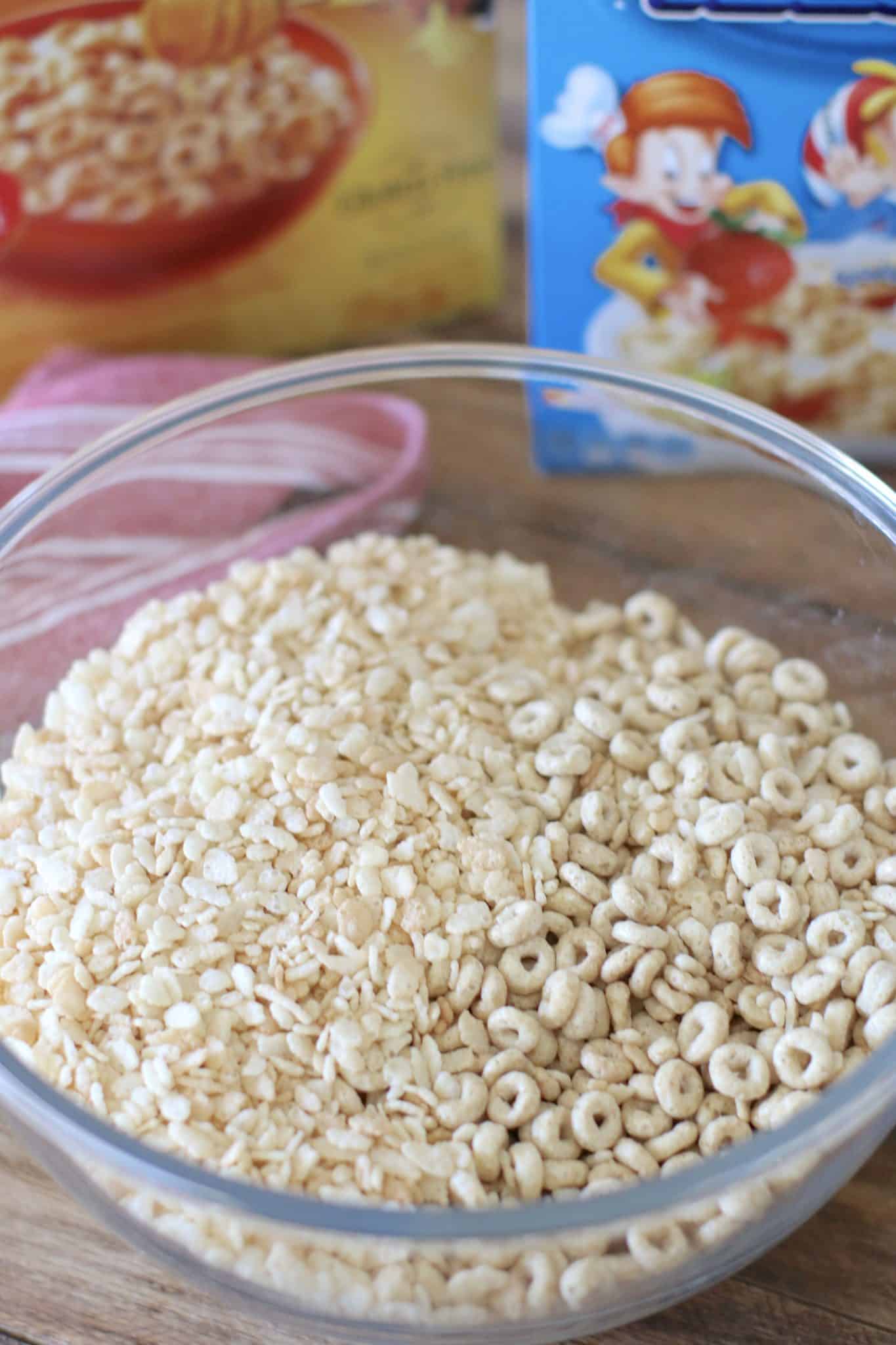 Rice Krispies and honey nut cheerios mixed together in a bowl.