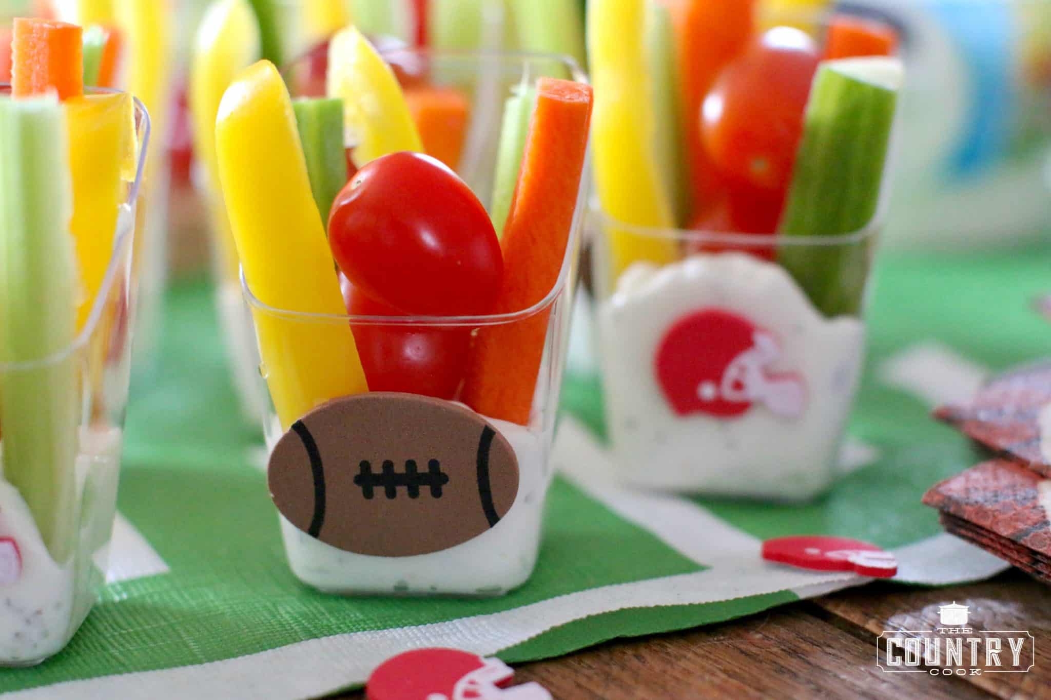Veggie Dip Cups shown with football stickers and football helmet stickers on the sides of the cups.