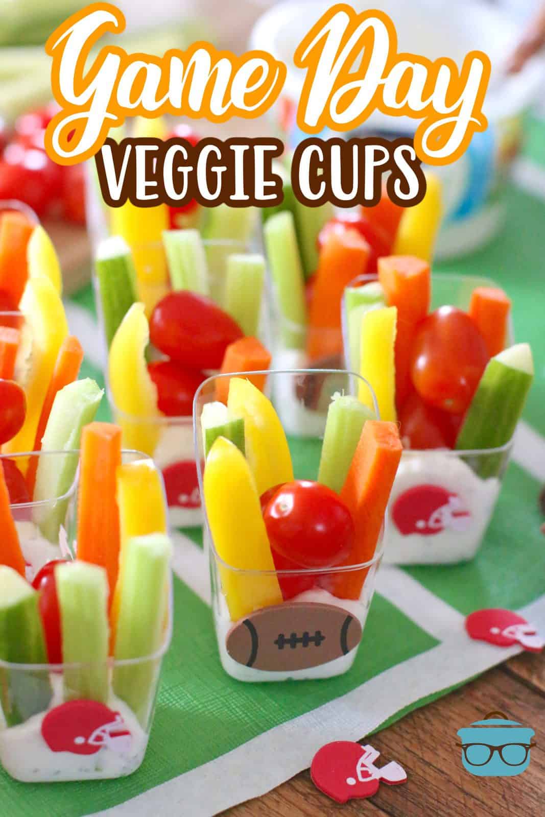 Clear little cups with slices of veggies in ranch dressing. 