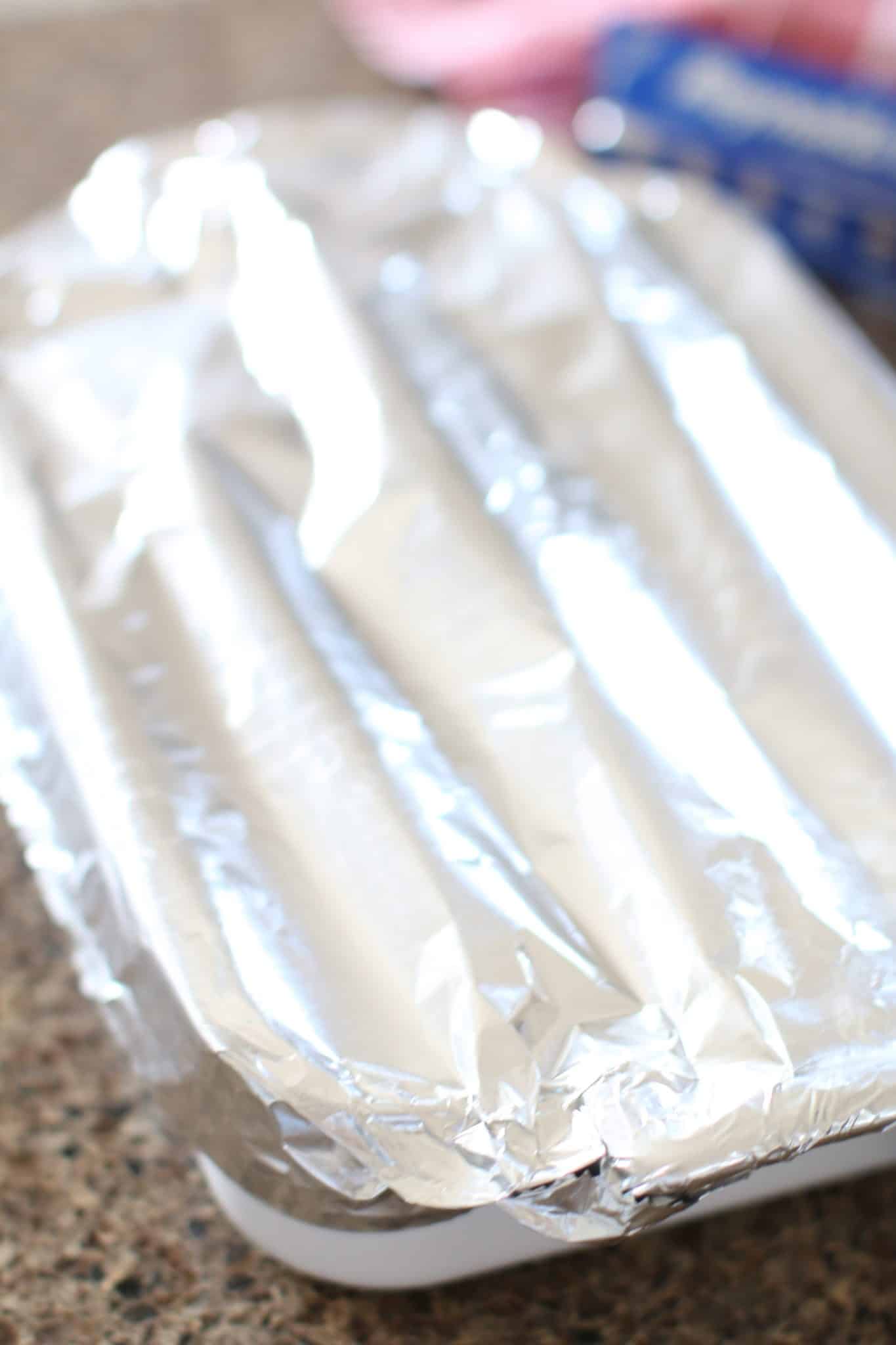 a casserole dish covered with aluminum foil.