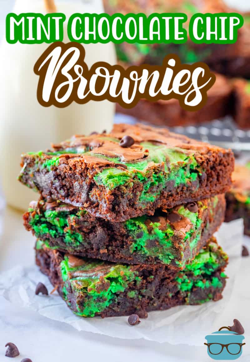 Mint Chocolate Chip Brownies recipe from The Country Cook - three slices of brownies stacked on top of each other on a square of parchment paper.