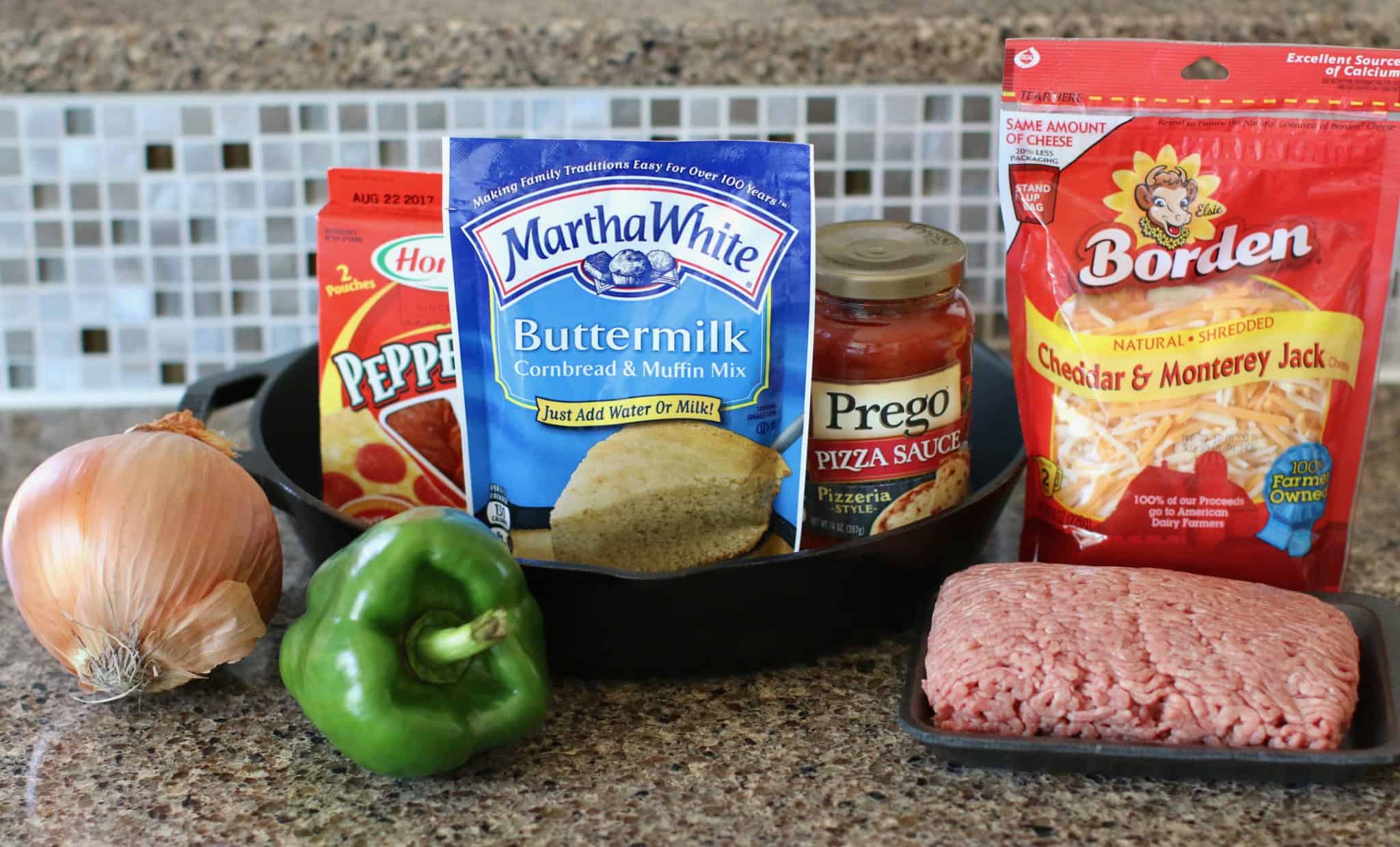 buttermilk cornbread mix, ground beef, pizza sauce, pepperoni slices, onion, green pepper, shredded cheese.