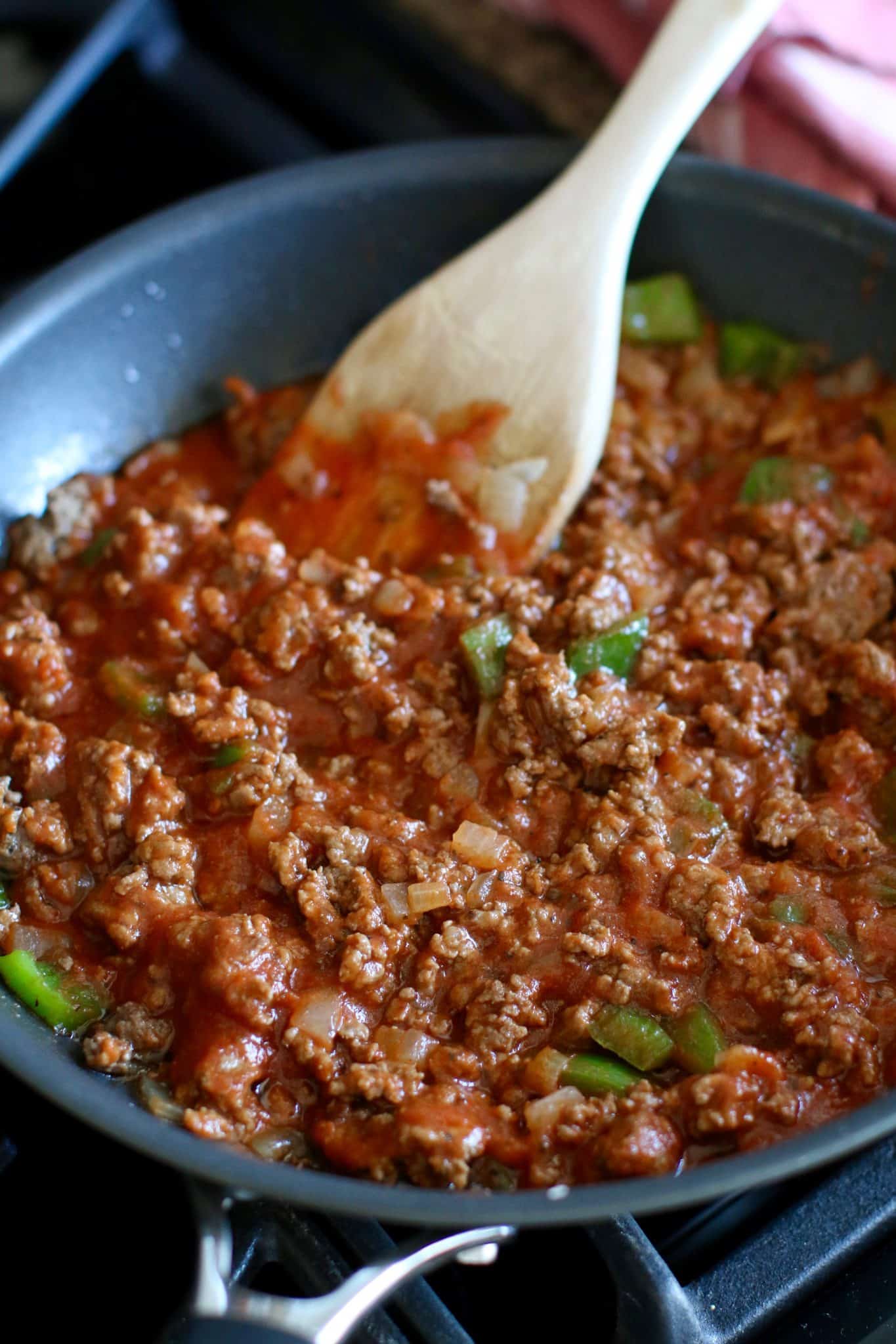 pizza sauce added to cooked ground beef mix.