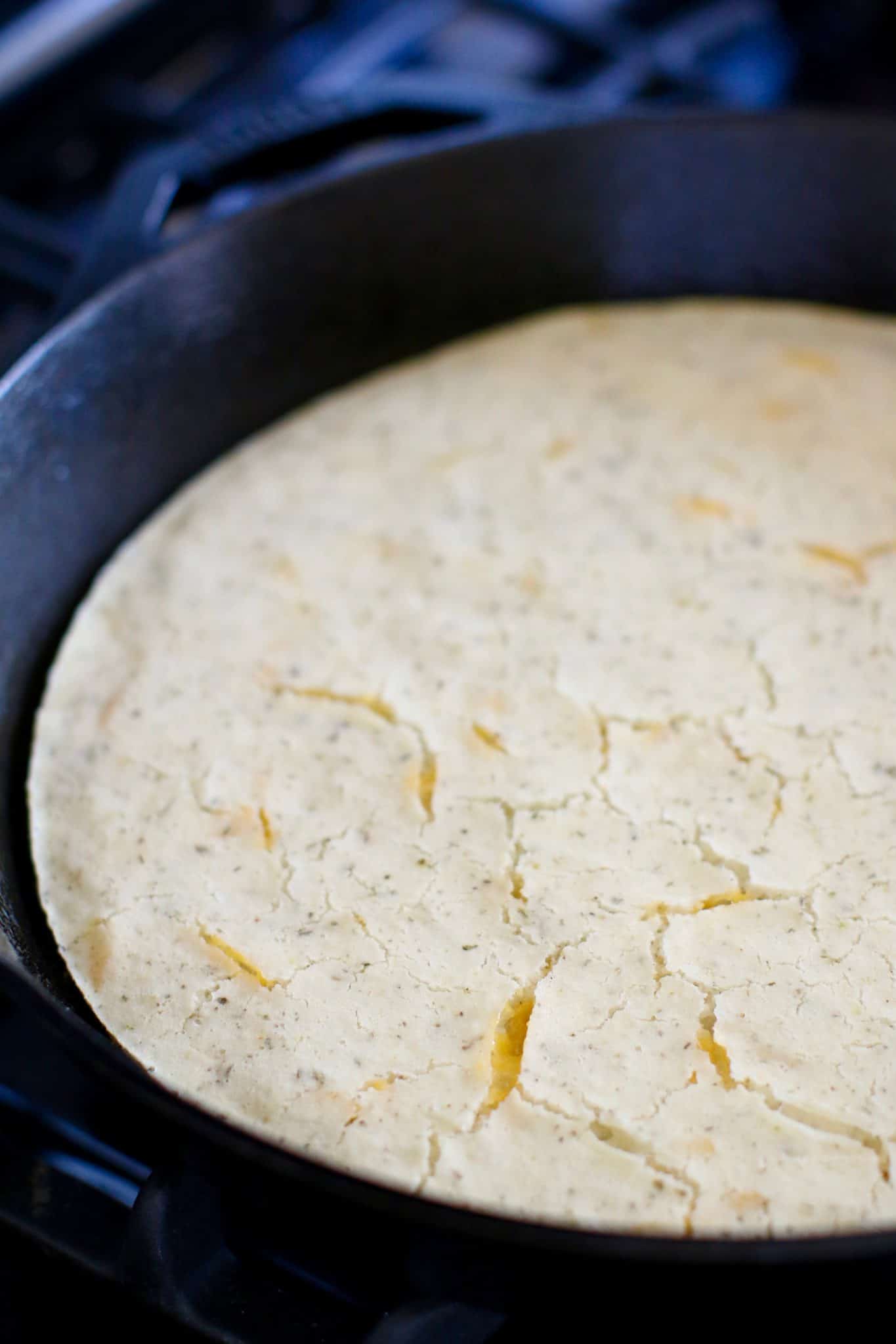Cooked cornbread crust in the cast iron skillet. 