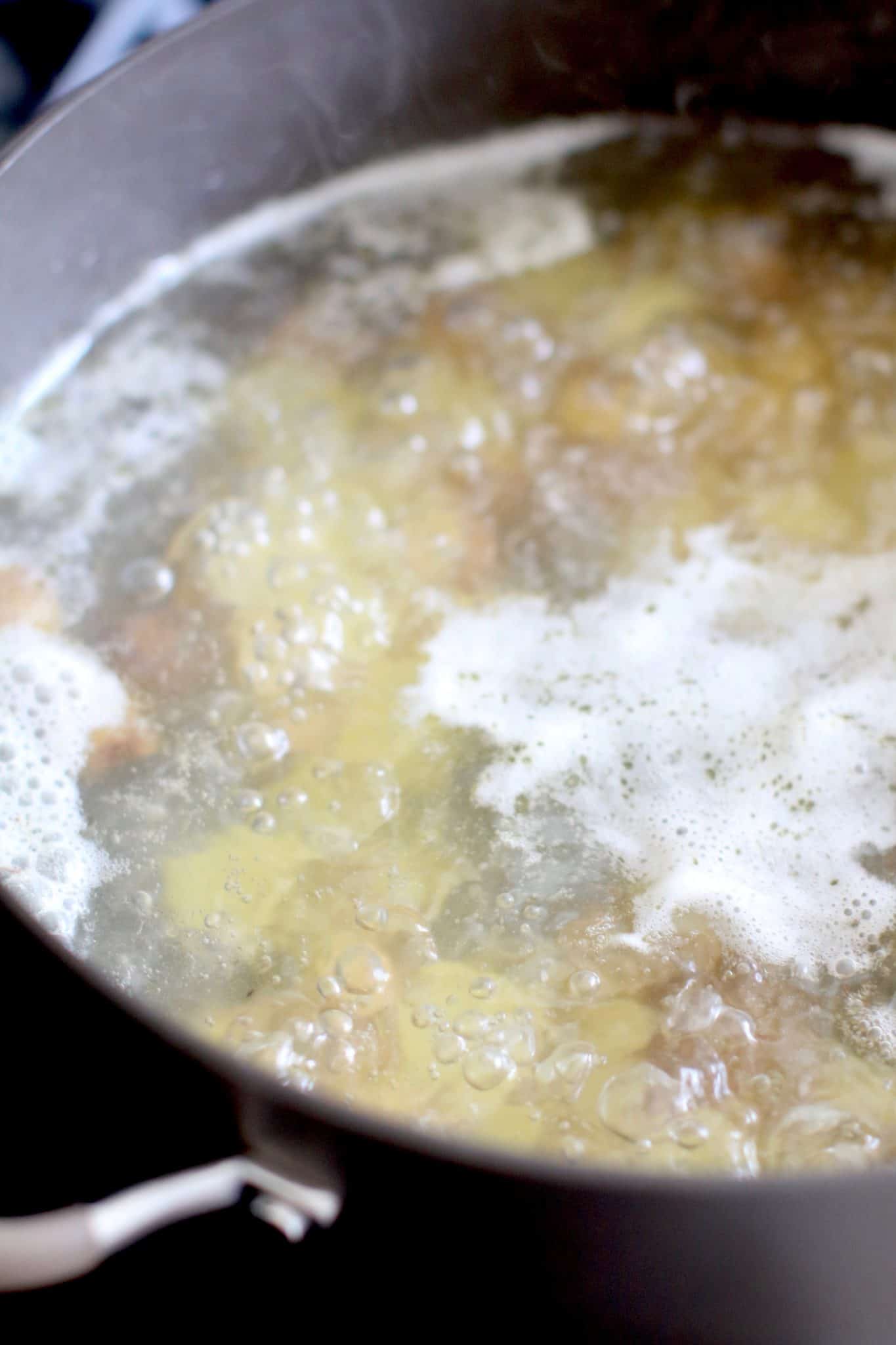boiling potatoes n a pot. 