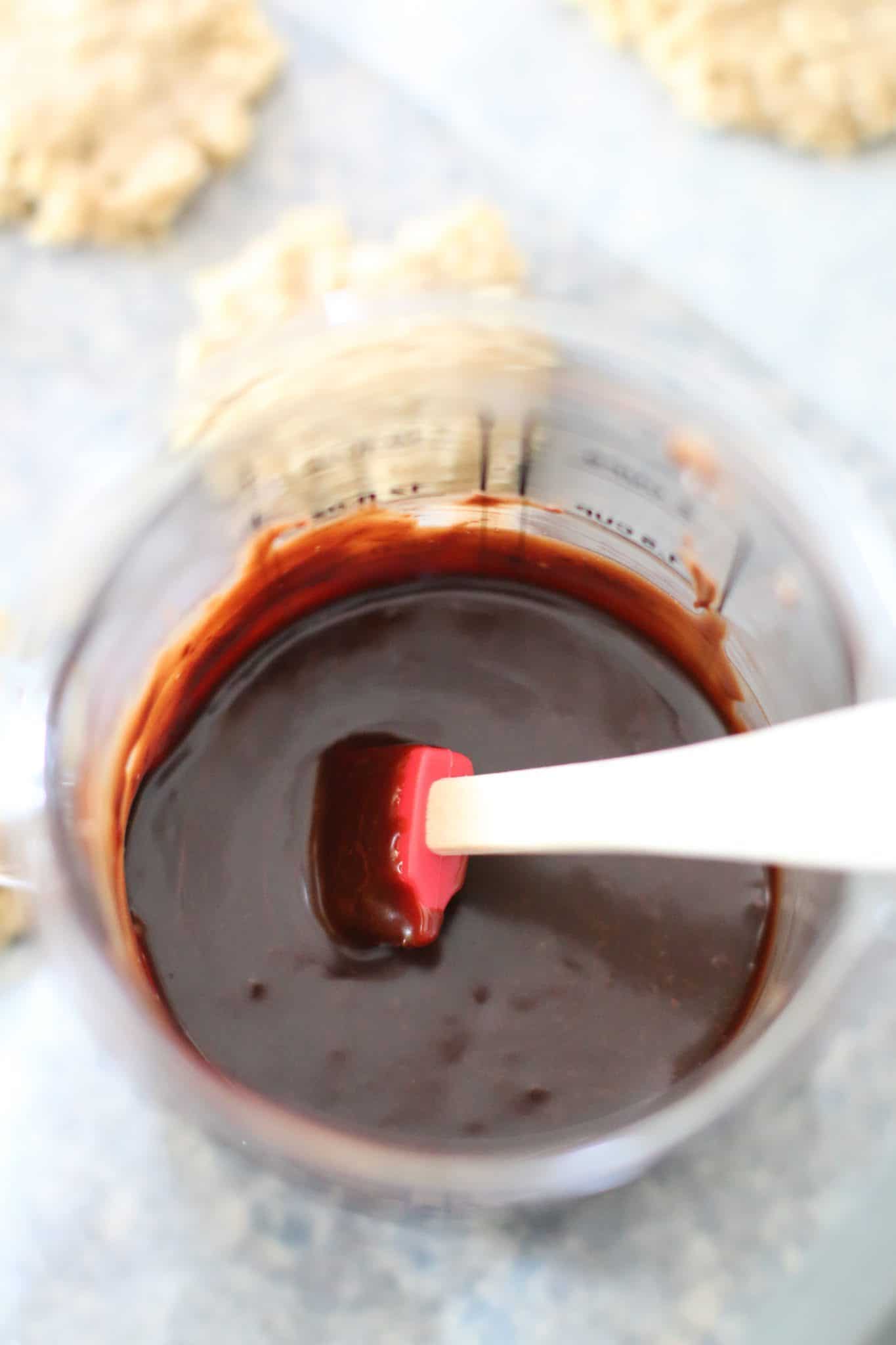 melted chocolate shown in a measuring cup.