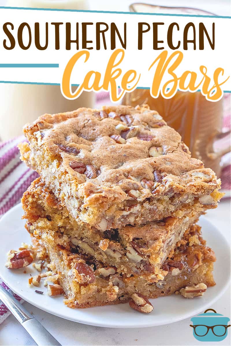 Southern Pecan Cake Bars recipe from The Country Cook. Three bars shown stacked on a small round white plate.