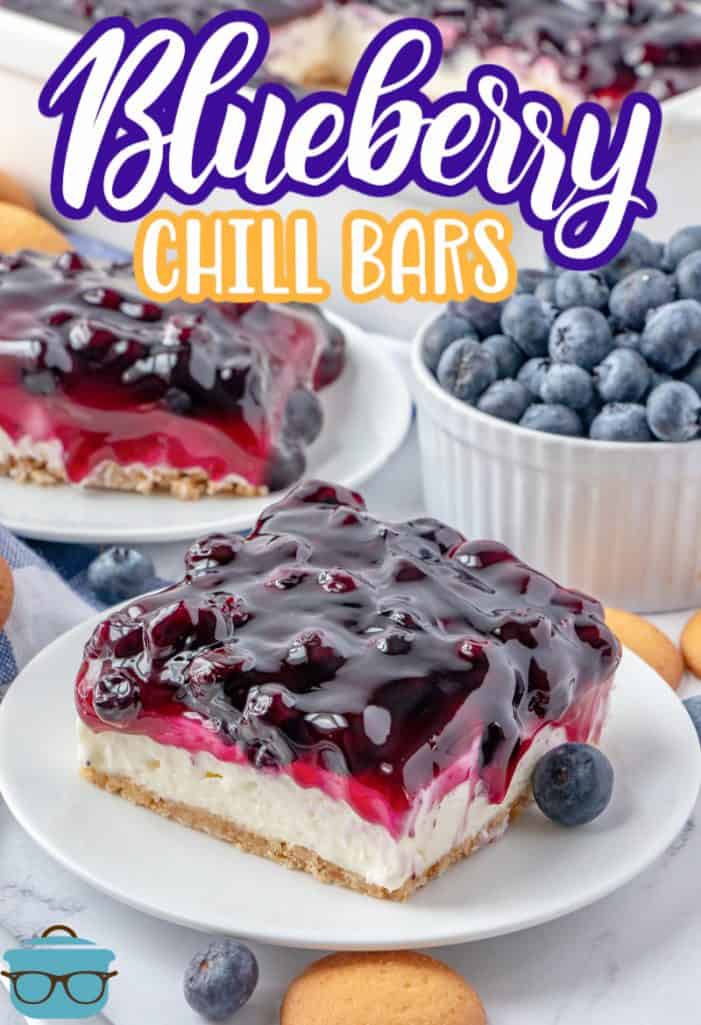 Blueberry Chill Bar recipe shown slice on a white plate with a bowl of fresh blueberries in the background