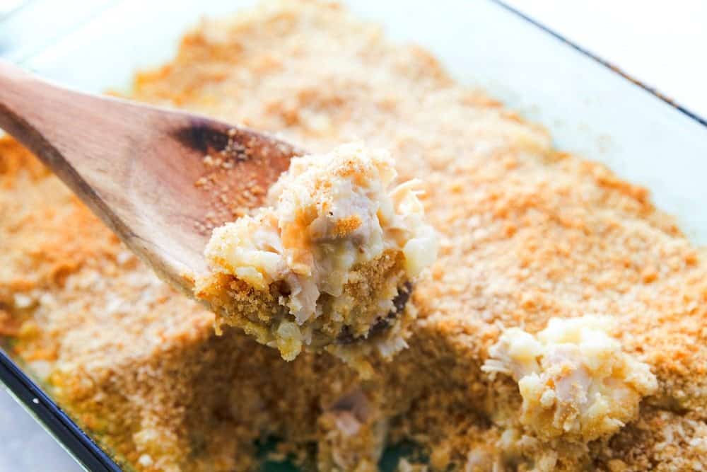 Spoonful of Chicken and Rice Casserole in a baking dish