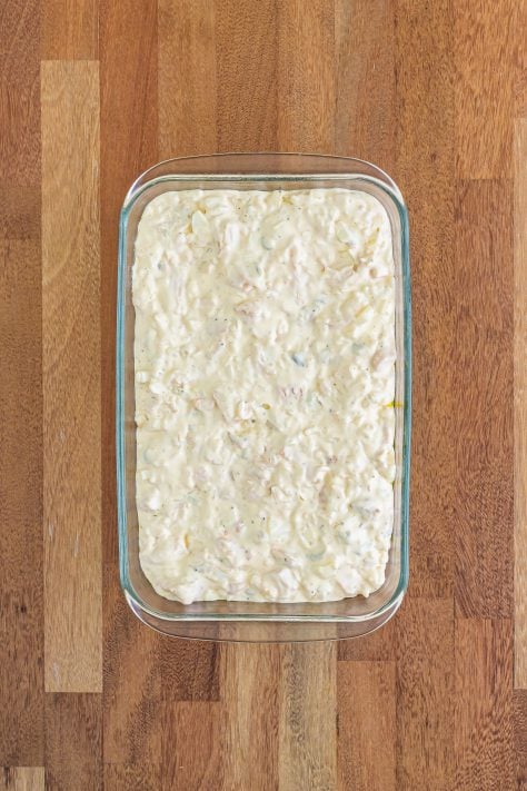 chicken and rice mixture spread into a baking dish.
