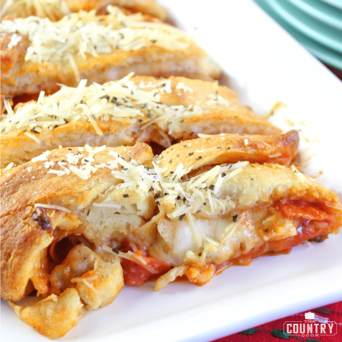 Easy Pepperoni and Sausage Stromboli shown closeup showing the inside filling.