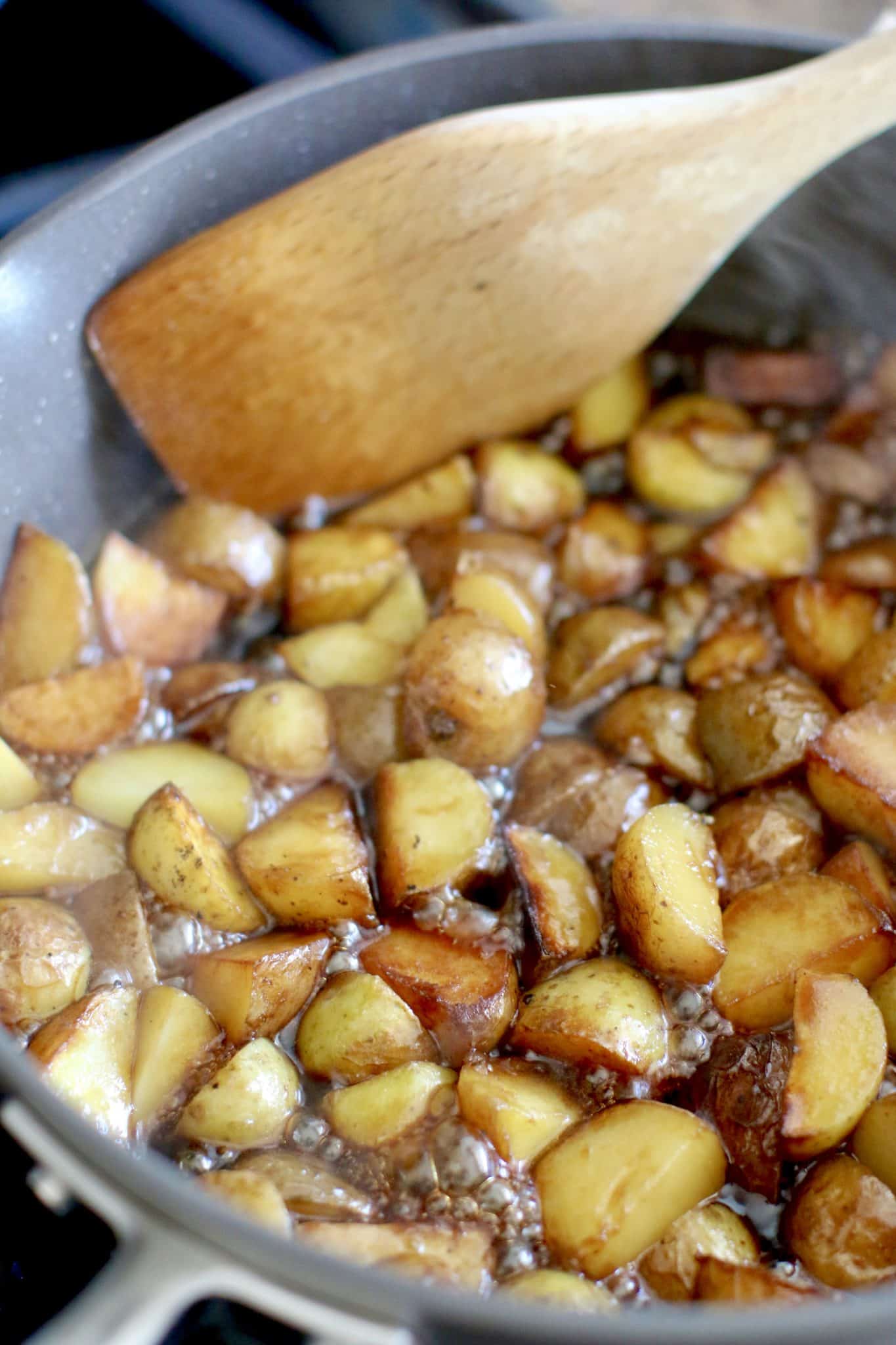 corn syrup and ketchup and soy sauce added into a skillet with the cooked potatoes. 