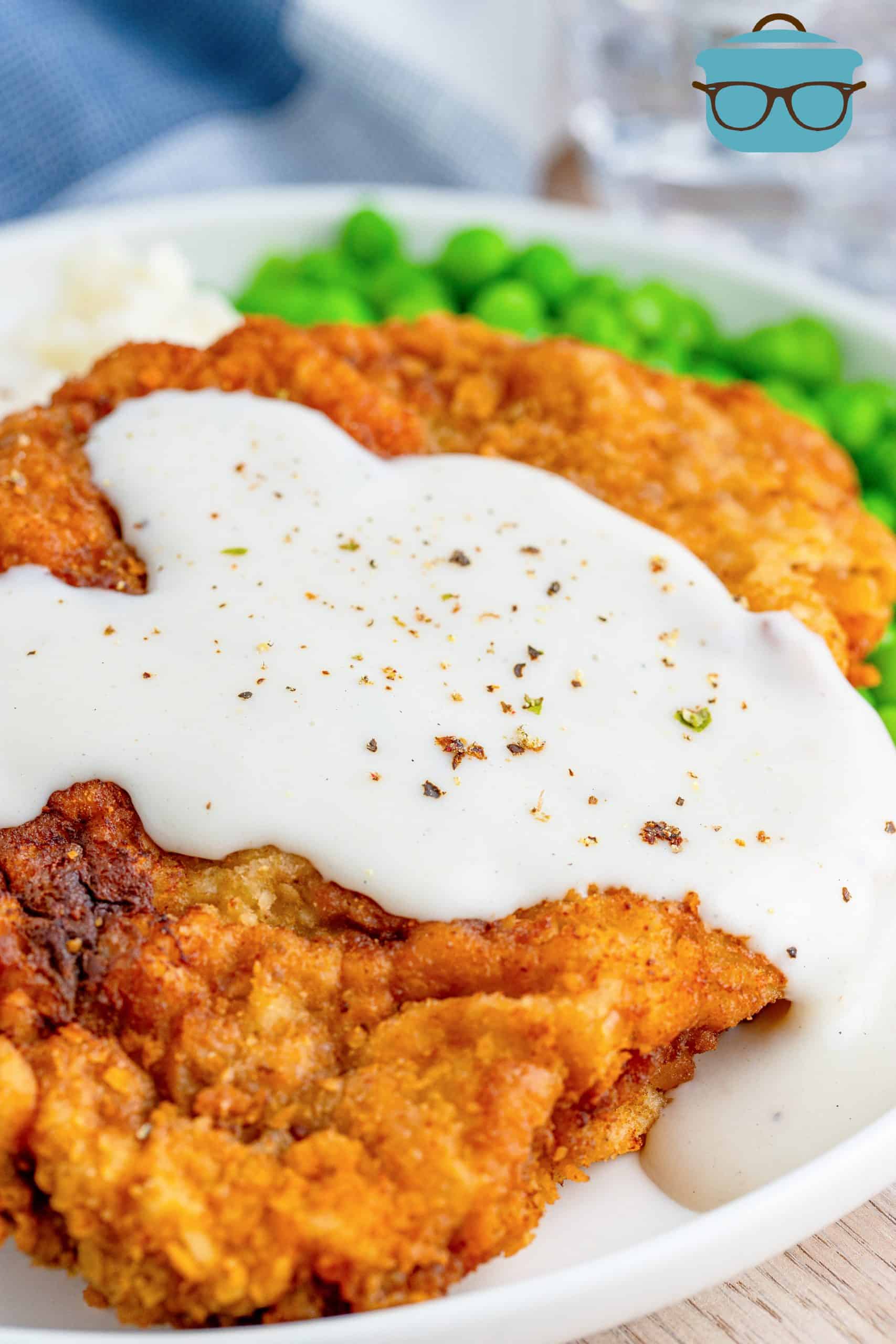 close up of Chicken Fried Steaks covered in white sawmill gravy.
