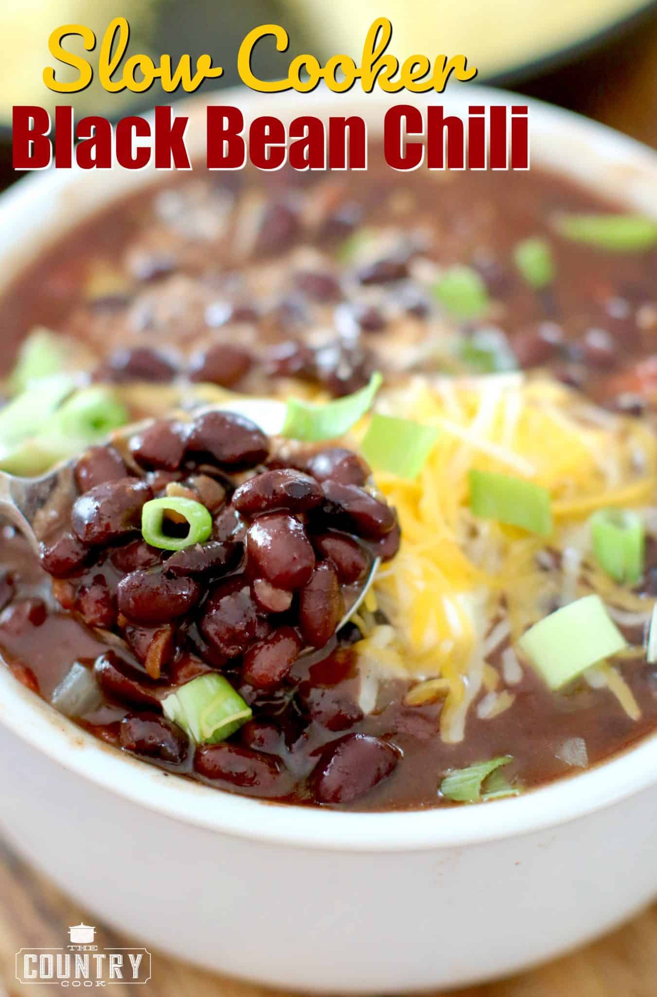 Slow Cooker Black Bean Chili recipe from The Country Cook shown in a white soup bowl with a spoon.