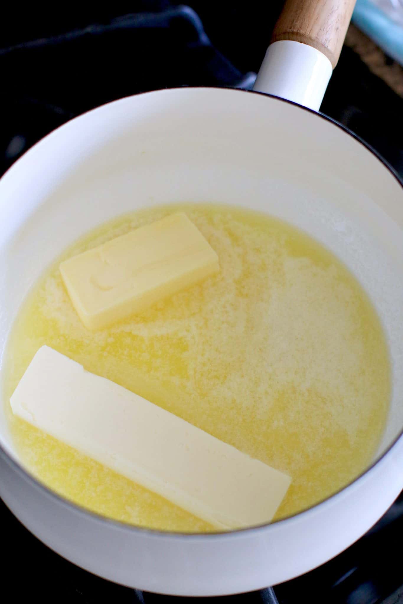 melting butter in a white sauce pot.