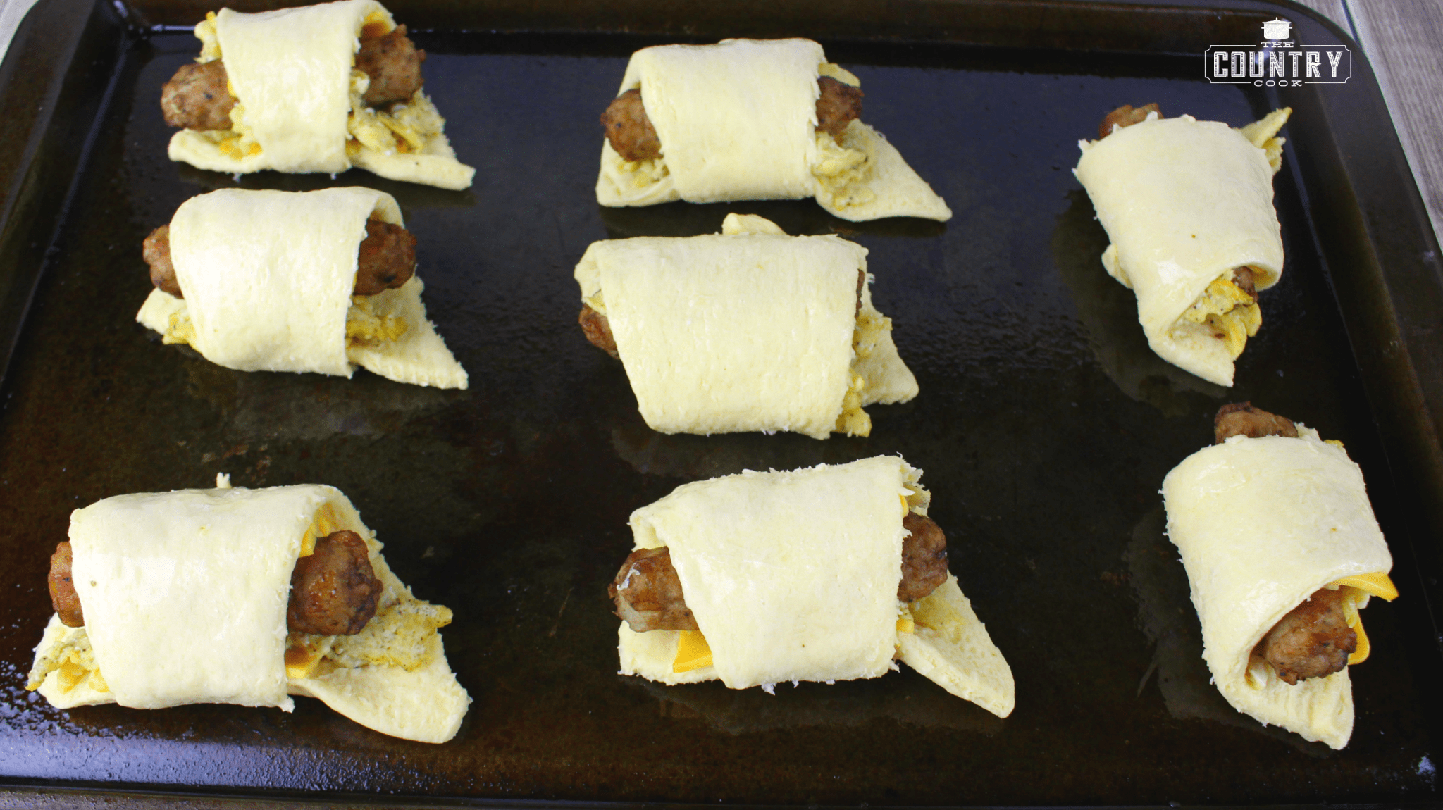 breakfast sausage rolls on baking dish.