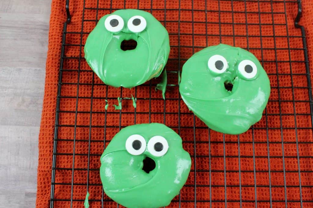 candy eyes on Frankenstein Doughnuts
