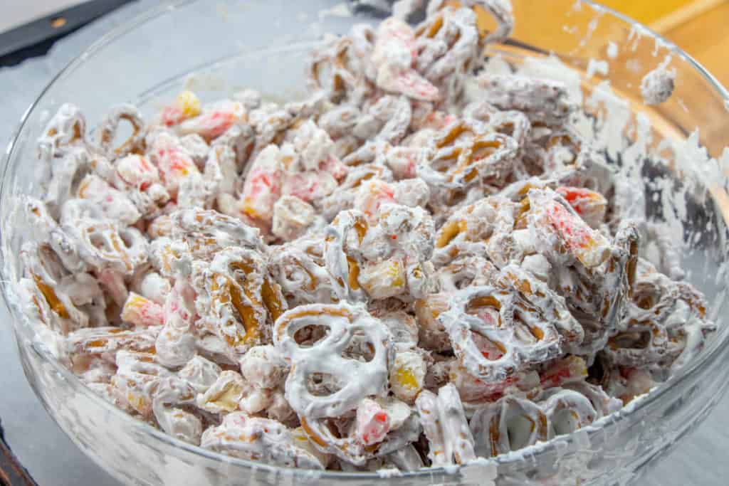 white chocolate covered snack mix mixed together in a large bowl