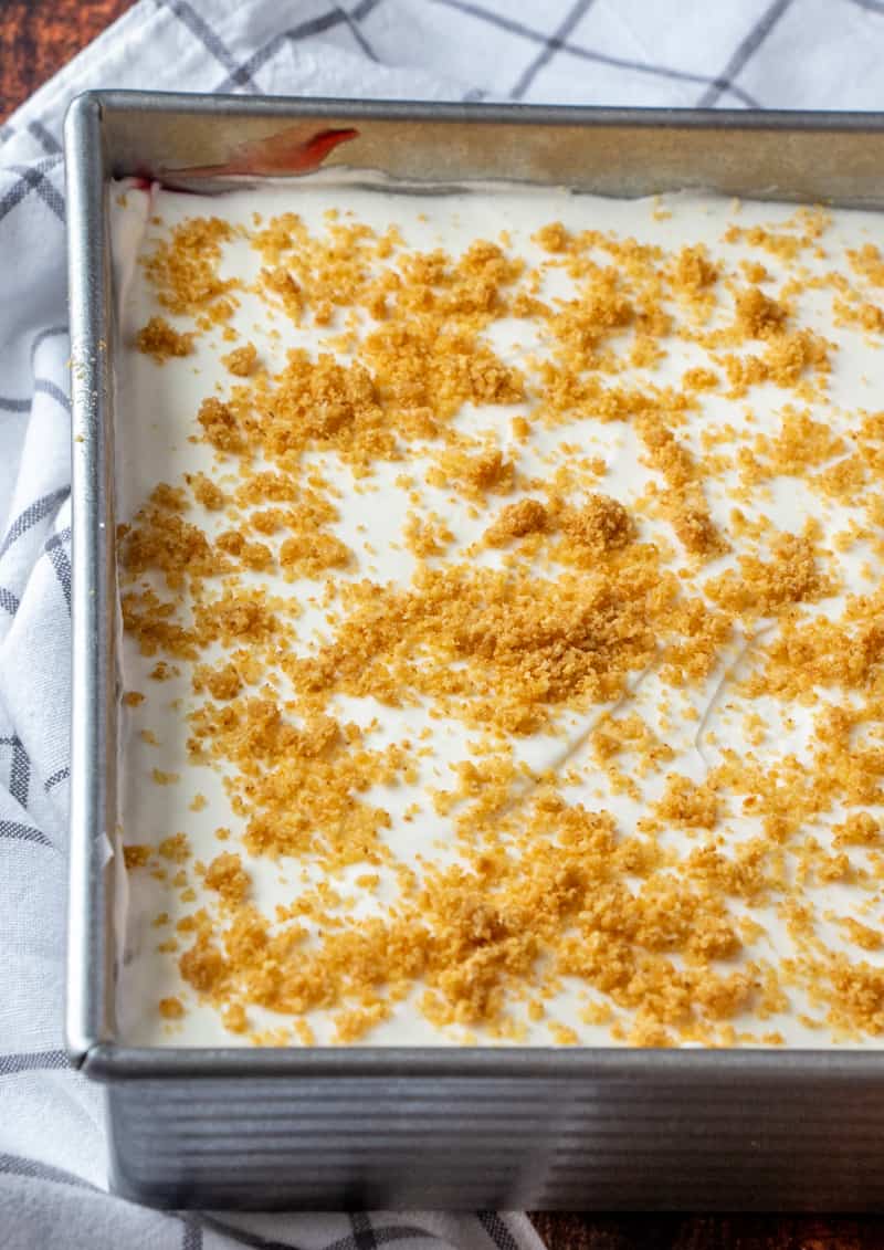 crushed graham cracker crumbs layered on top of whipped topping layer.