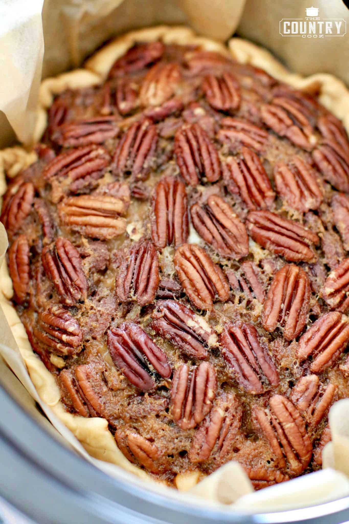 finished, cooked, pecan pie in the crockpot/ slow cooker.