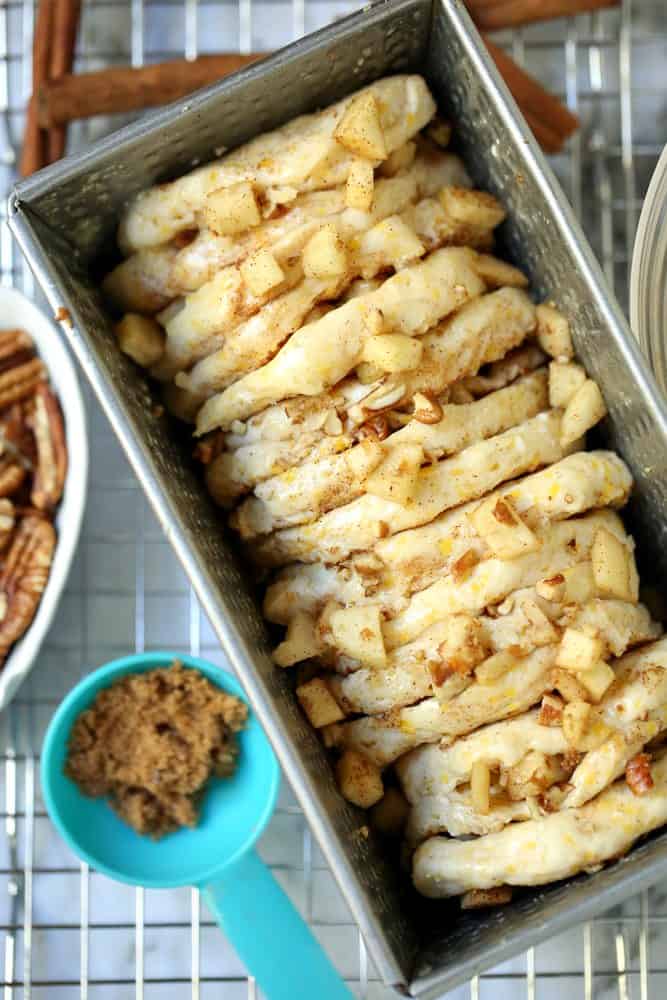 apple cinnamon pecans and canned biscuits in a loaf pan