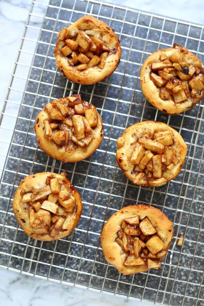 baked apple pie cups on a cooling rack
