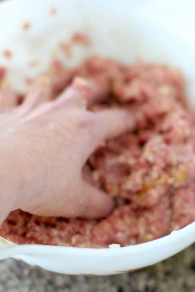 hand mixing meatloaf mixture