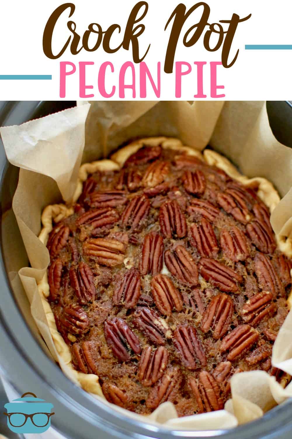 Slow Cooker Pecan Pie recipe from The Country Cook. Fully baked pie shown inside an oval slow cooker.