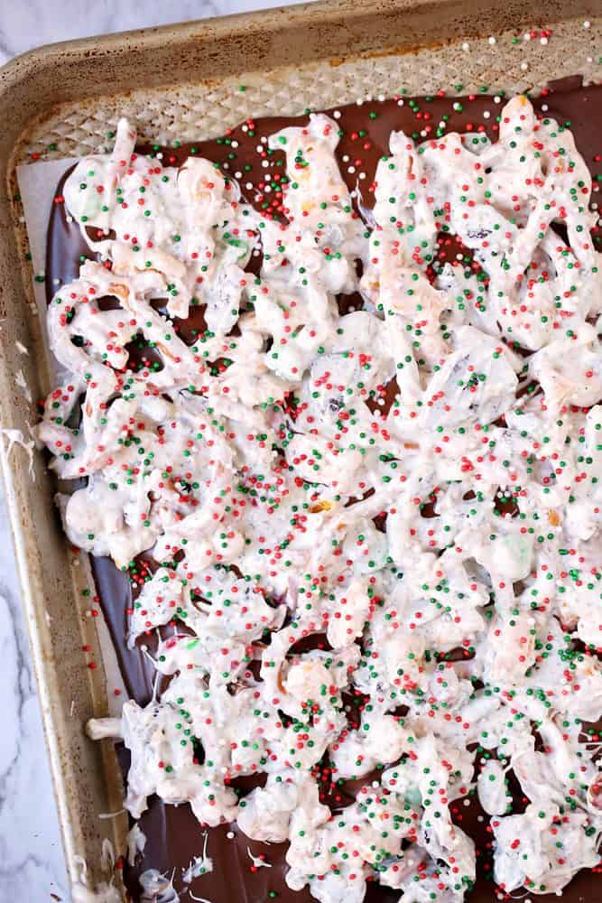 vanilla almond bark (white chocolate) mixed with pretzels and candy and layered onto melted chocolate on baking sheet.