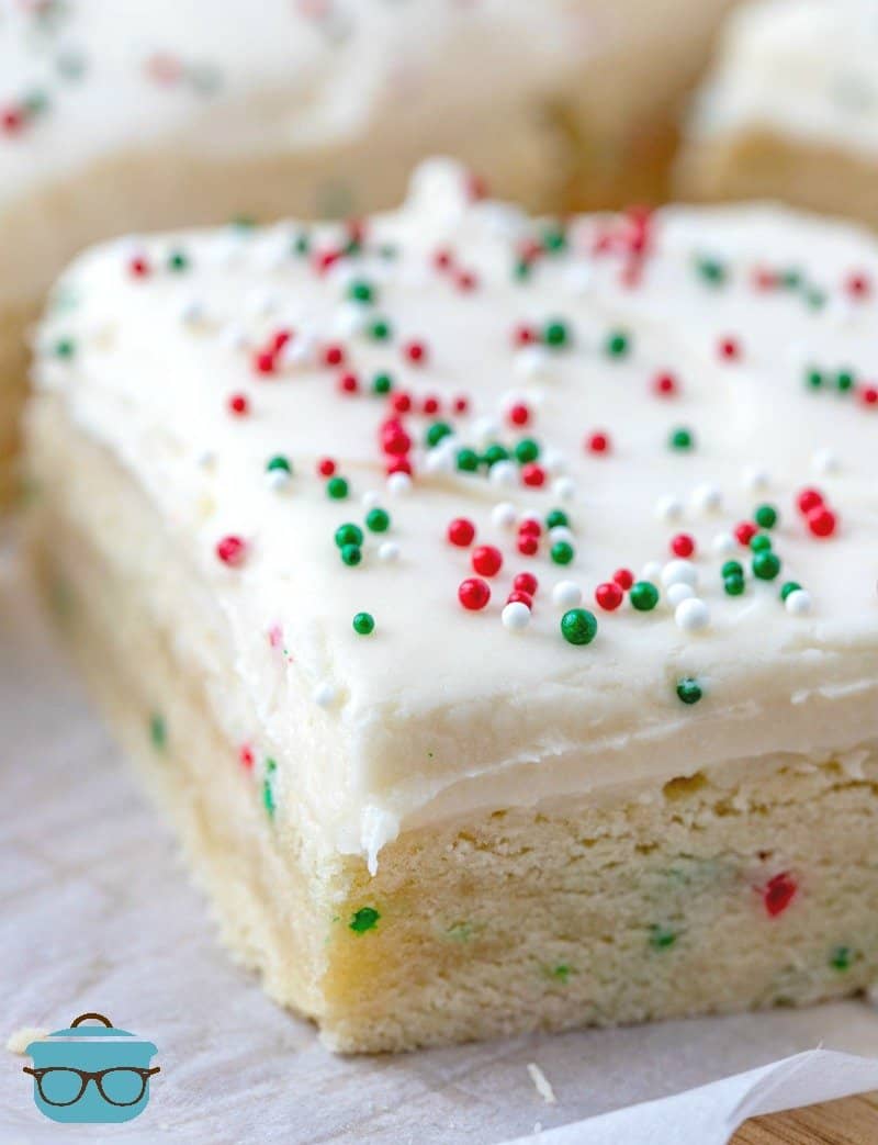close up, homemade sugar cookie bars topped with cream cheese frosting.
