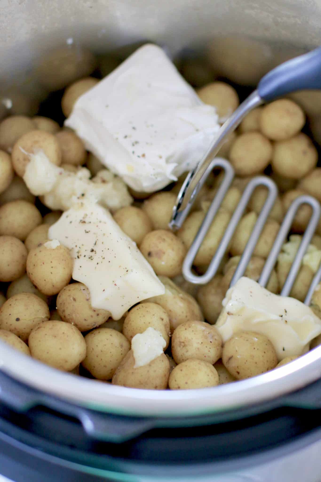 butter, cream cheese, garlic, salt and pepper added to steamed potatoes.