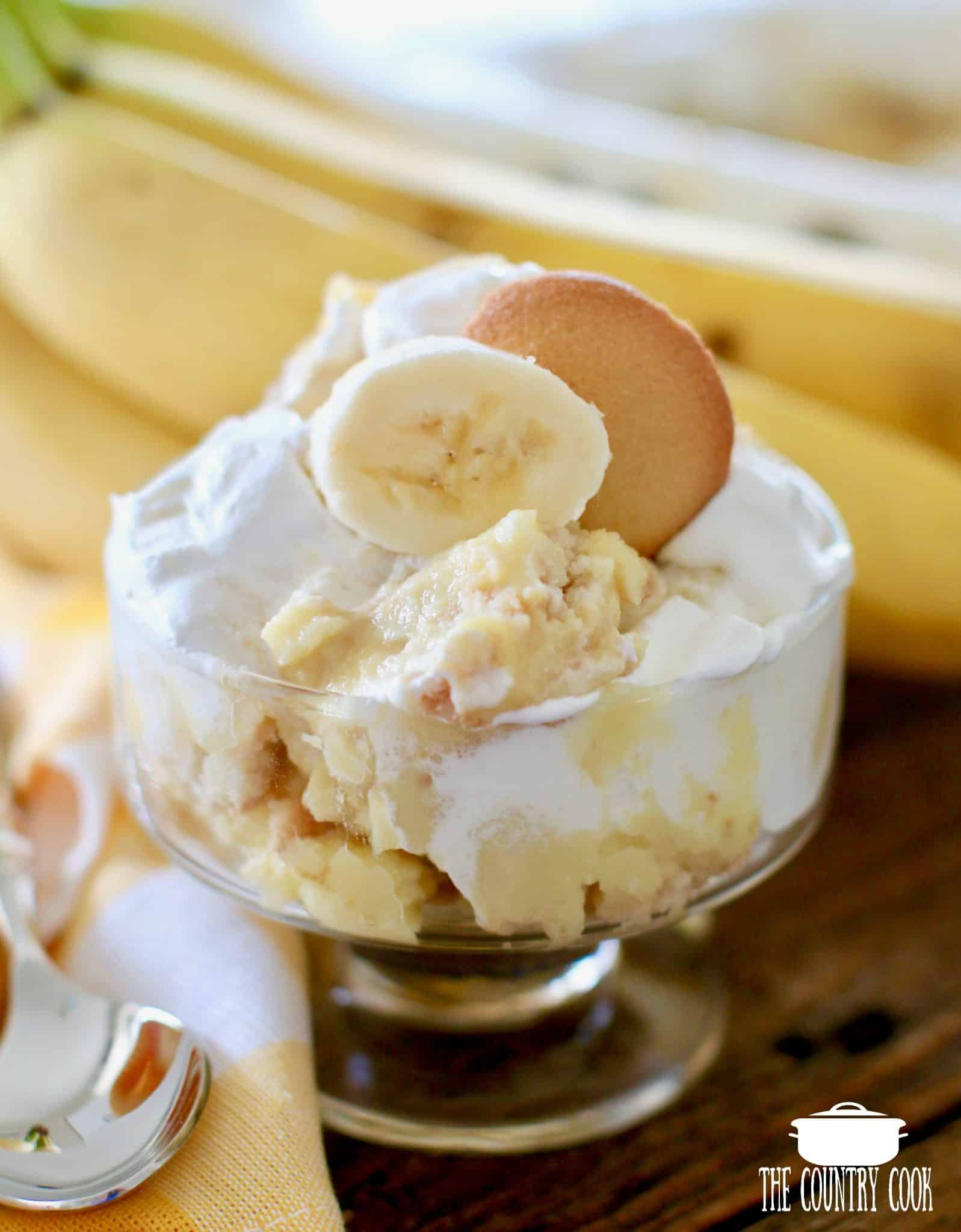 a serving of healthier banana pudding shown in a glass dessert bowl. 