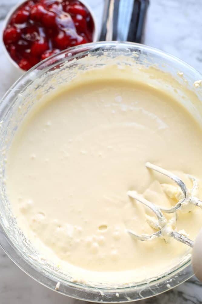 low carb cheesecake batter in a clear bowl.