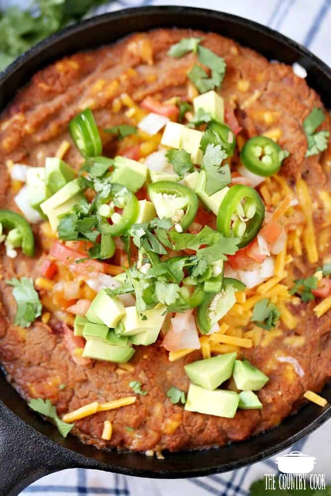 Refried Bean Skillet with tomatoes, onions, avocadoes and cilantro