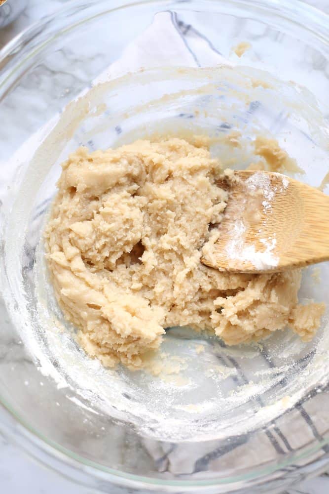 pecan pie bar dough, vanilla extract, butter, flour, sugar in a bowl.