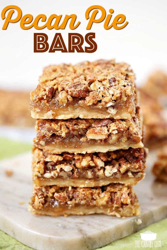 Pecan Pie Bars recipe from The Country Cook. Bars shown stacked on a marble surface.
