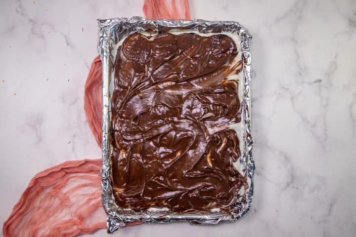 swirled melted milk chocolate on top of vanilla chocolate layer.