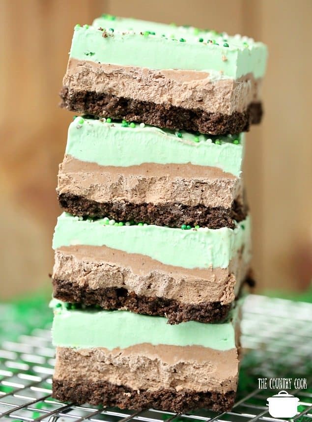 No-Bake Mint Chocolate Cheesecake Bars, sliced and on a cooling rack 