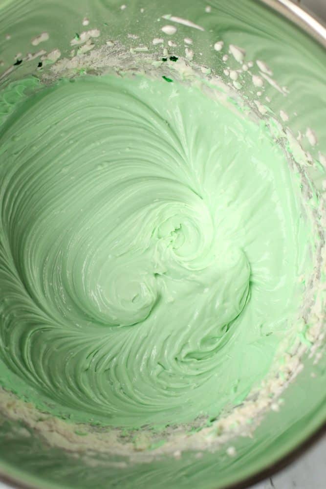 cream cheese, powdered sugar, whipped cream, and green gel color 