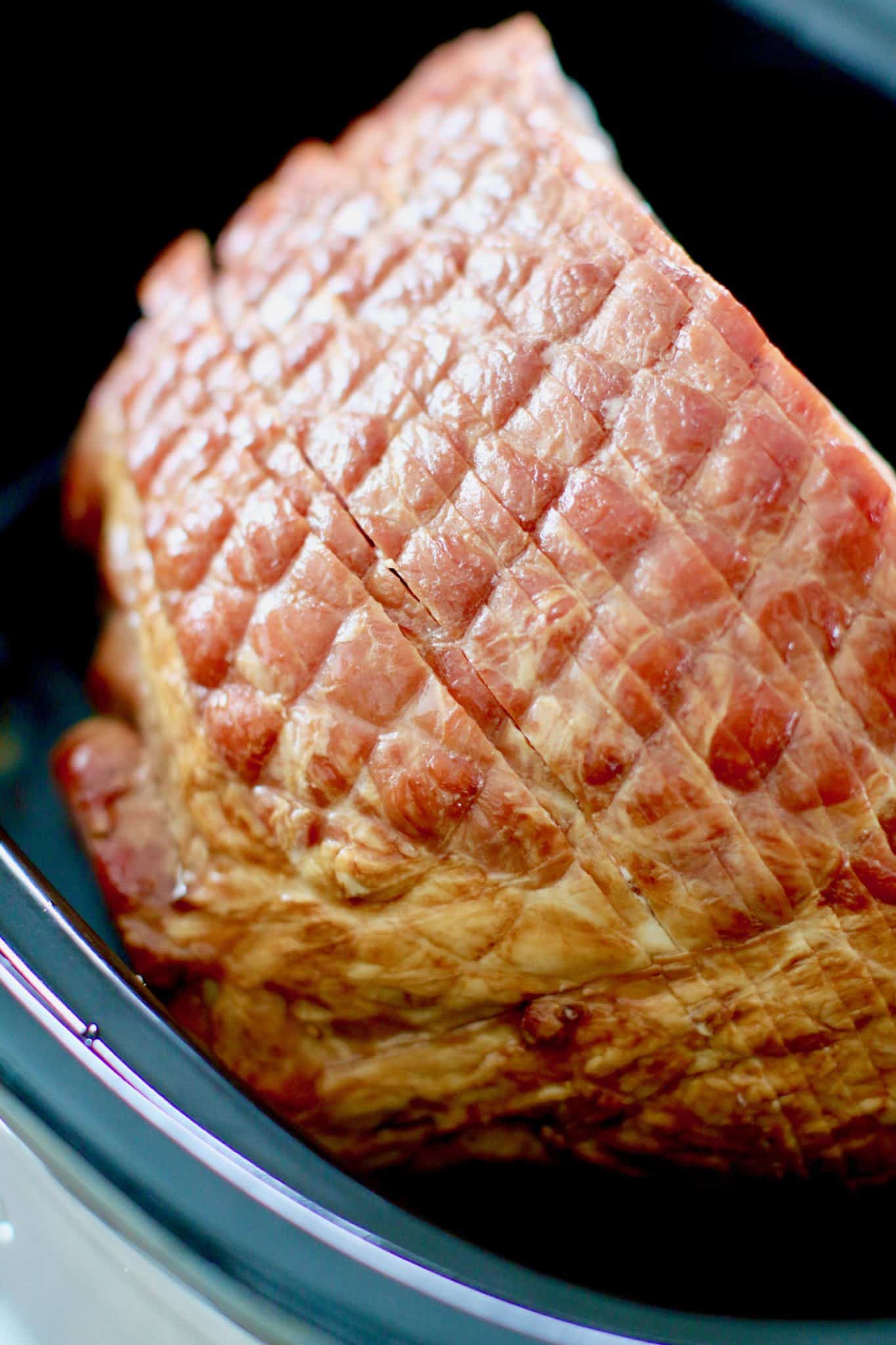 spiral sliced ham in an oval 8-quart slow cooker.
