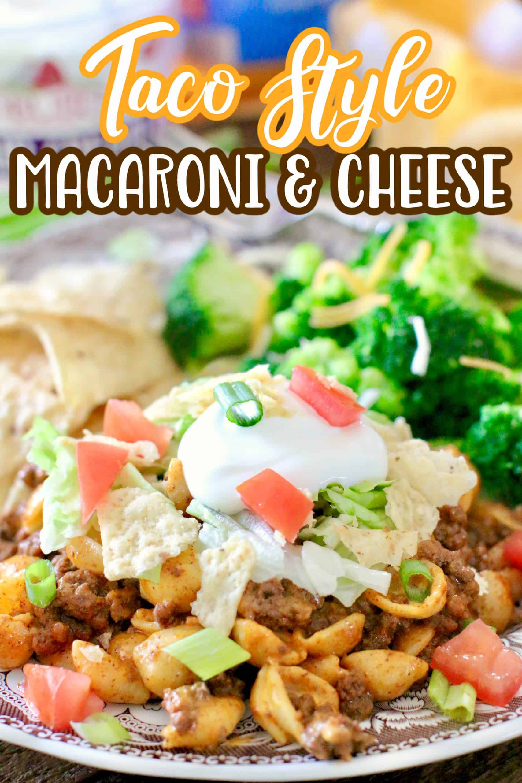 Easy Taco Macaroni and Cheese recipe shown served on a plate with steamed broccoli and tortilla chips.