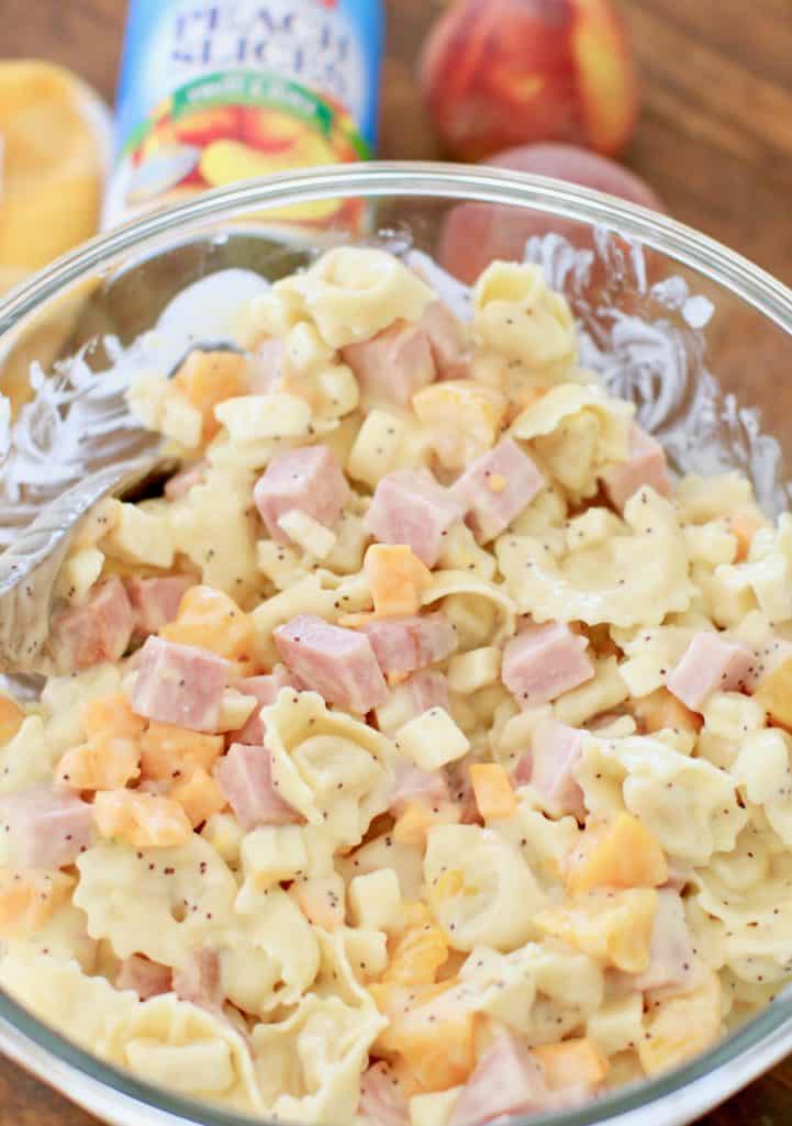 cold pasta salad with tortellini, cheddar cheese, smoked ham and Libby's Peach Slices