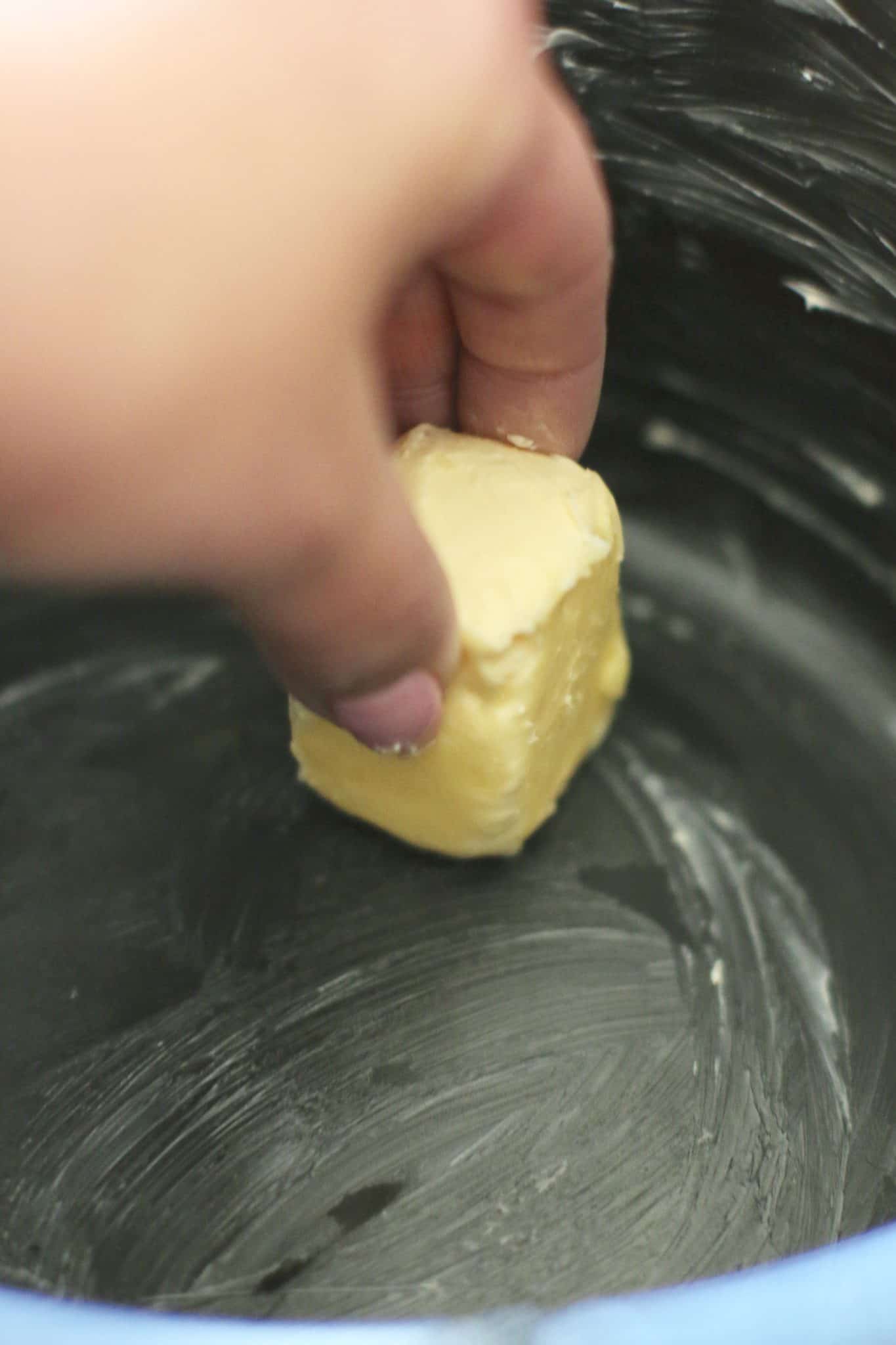 buttering a 5-quart crock pot.
